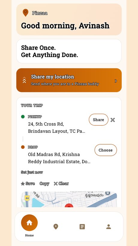 Pinzaa home screen showing Share my location and a trip with pickup and drop